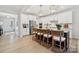 Spacious kitchen with island seating, stainless steel appliances, and stylish light fixtures and decor at 4010 Caymen Bay Ct, Tega Cay, SC 29708