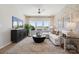 Inviting living room with large windows, stylish furniture, and wood floors, perfect for relaxation at 4010 Caymen Bay Ct, Tega Cay, SC 29708