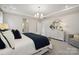 Serene primary bedroom featuring a tray ceiling, plush bedding, and elegant decor at 4010 Caymen Bay Ct, Tega Cay, SC 29708