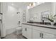 Elegant bathroom showcases a double vanity, modern fixtures and a stylish, tiled floor at 5361 Mint Harbor Way # 0301, Charlotte, NC 28269