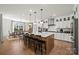Spacious kitchen with large island, modern appliances, and breakfast bar seating at 5361 Mint Harbor Way # 0301, Charlotte, NC 28269