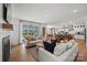 Open-concept living room flows into the modern kitchen and dining area at 5361 Mint Harbor Way # 0301, Charlotte, NC 28269