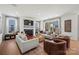 Bright living room with fireplace, hardwood floors, and sliding door to the patio at 5361 Mint Harbor Way # 0301, Charlotte, NC 28269