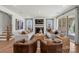 Cozy living room featuring fireplace, hardwood floors, and ample seating at 5361 Mint Harbor Way # 0301, Charlotte, NC 28269