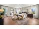 Serene main bedroom featuring a four-poster bed, seating area, and large windows at 5361 Mint Harbor Way # 0301, Charlotte, NC 28269
