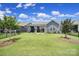 Well-maintained fenced backyard with lush lawn and view of screened-in porch at 537 Lincoln Quarters Ln, Fort Mill, SC 29708