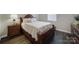 Bedroom with wood floors, a wood-frame bed, and a window with natural light at 537 Lincoln Quarters Ln, Fort Mill, SC 29708