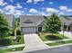 Charming home showcasing well-manicured landscaping, an attached two-car garage, and a spacious driveway at 537 Lincoln Quarters Ln, Fort Mill, SC 29708