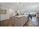 Spacious kitchen island with granite countertops, farmhouse sink, and seating, offering ample prep and gathering space at 537 Lincoln Quarters Ln, Fort Mill, SC 29708