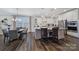 Bright kitchen with white cabinets, stainless steel appliances, and a large granite island at 537 Lincoln Quarters Ln, Fort Mill, SC 29708