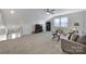 Living room with carpet, a ceiling fan, a tv, and a cozy seating area at 537 Lincoln Quarters Ln, Fort Mill, SC 29708