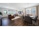 Spacious living room with modern furnishings and a dining area with view of the modern kitchen at 537 Lincoln Quarters Ln, Fort Mill, SC 29708