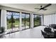 Cozy sunroom with large windows and backyard views, with comfortable seating and tile flooring at 537 Lincoln Quarters Ln, Fort Mill, SC 29708
