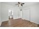 Spacious bedroom boasts hardwood floors, ceiling fan, and easy access to an adjoining bathroom at 8106 Strawberry Point Dr, Charlotte, NC 28215