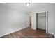Minimalist bedroom with hardwood floors and a closet offers a blank canvas ready for personalization at 8106 Strawberry Point Dr, Charlotte, NC 28215