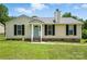 Charming single-story home with a well-manicured lawn and black shutters at 8106 Strawberry Point Dr, Charlotte, NC 28215