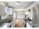 Bright kitchen with granite countertops, stainless steel appliances, and dining area at 8106 Strawberry Point Dr, Charlotte, NC 28215