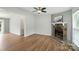 Spacious living room with hardwood floors, ceiling fan, and natural light at 8106 Strawberry Point Dr, Charlotte, NC 28215