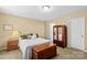 Cozy bedroom showcasing a classic-style bed and antique wooden furniture set against neutral walls at 105 Whimbrel Ln, Mooresville, NC 28117