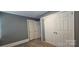 Neutral bedroom featuring wood floors and large closet doors at 1904 E Innes St, Salisbury, NC 28146