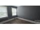 Serene bedroom featuring wood floors and natural light from two windows at 1904 E Innes St, Salisbury, NC 28146
