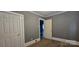 Neutral bedroom featuring wood floors and a doorway to the next room at 1904 E Innes St, Salisbury, NC 28146