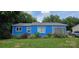 Charming blue home with white window frames and a manicured lawn at 1904 E Innes St, Salisbury, NC 28146