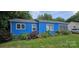 Charming blue home with white window frames and a manicured lawn at 1904 E Innes St, Salisbury, NC 28146