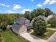 Beautiful aerial view of a two-story home with a lush green lawn and mature trees at 191 Harris Farm Rd, Mooresville, NC 28115