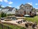 Backyard featuring a pool, hot tub, spacious deck, and a lush green lawn at 191 Harris Farm Rd, Mooresville, NC 28115