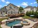 Backyard oasis featuring a pool, hot tub, lounge chairs, and a spacious deck at 191 Harris Farm Rd, Mooresville, NC 28115
