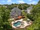 Aerial view of backyard featuring a pool, spa, deck and outdoor seating area at 191 Harris Farm Rd, Mooresville, NC 28115