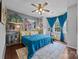 Inviting bedroom with unique decor, hardwood floors, and a cozy window seating area at 191 Harris Farm Rd, Mooresville, NC 28115