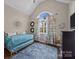Cozy bedroom with an arched window, hardwood floors, and a decorative vanity at 191 Harris Farm Rd, Mooresville, NC 28115