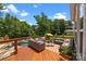Inviting deck area with comfortable outdoor seating, overlooking a serene pool and lush greenery at 191 Harris Farm Rd, Mooresville, NC 28115