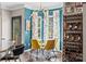 Bright dining area with a round glass table, stylish chairs, and a view of the deck at 191 Harris Farm Rd, Mooresville, NC 28115