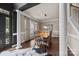 Open dining room with hardwood floors, chandelier, and a large window at 191 Harris Farm Rd, Mooresville, NC 28115