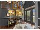 Elegant foyer with dark walls, hardwood floors, and decorative artwork at 191 Harris Farm Rd, Mooresville, NC 28115