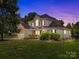 Charming two-story home with a well-manicured lawn and inviting front porch at 191 Harris Farm Rd, Mooresville, NC 28115
