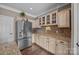 Well-appointed kitchen with stainless steel refrigerator, custom cabinets, and granite countertops at 191 Harris Farm Rd, Mooresville, NC 28115
