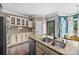 Large kitchen island with stainless steel sink and view of dining area at 191 Harris Farm Rd, Mooresville, NC 28115