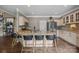 Spacious kitchen featuring a large island, stainless steel refrigerator, and custom cabinetry at 191 Harris Farm Rd, Mooresville, NC 28115