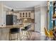 Gourmet kitchen with a large island, bar seating, stainless steel appliances, and custom cabinetry at 191 Harris Farm Rd, Mooresville, NC 28115