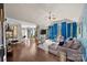 Open living area with a stylish blue accent wall, hardwood floors, and access to outdoor space at 191 Harris Farm Rd, Mooresville, NC 28115