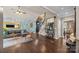 Spacious living room boasts hardwood floors, a large mirror, and an eclectic decorative style at 191 Harris Farm Rd, Mooresville, NC 28115