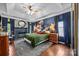 Comfortable main bedroom features a decorative fireplace, and tray ceiling with a ceiling fan at 191 Harris Farm Rd, Mooresville, NC 28115