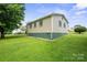 The rear of the home, highlighting its well-maintained vinyl siding and lush green backyard at 2321 Cline St, Statesville, NC 28677