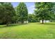 A sprawling green lawn features a small storage shed, providing ample outdoor space at 2321 Cline St, Statesville, NC 28677