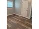 Bedroom featuring updated hardwood flooring, paint, and a window providing natural light at 2321 Cline St, Statesville, NC 28677