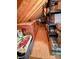 Well-organized attic storage area with wooden beams, shelving, boxes, and plastic storage containers at 233 Highland Forest Dr, Clover, SC 29710